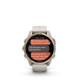 Garmin fēnix® 8 – 43 mm, AMOLED Sapphire, Soft gold with Fog grey/dark sandstone silicone band